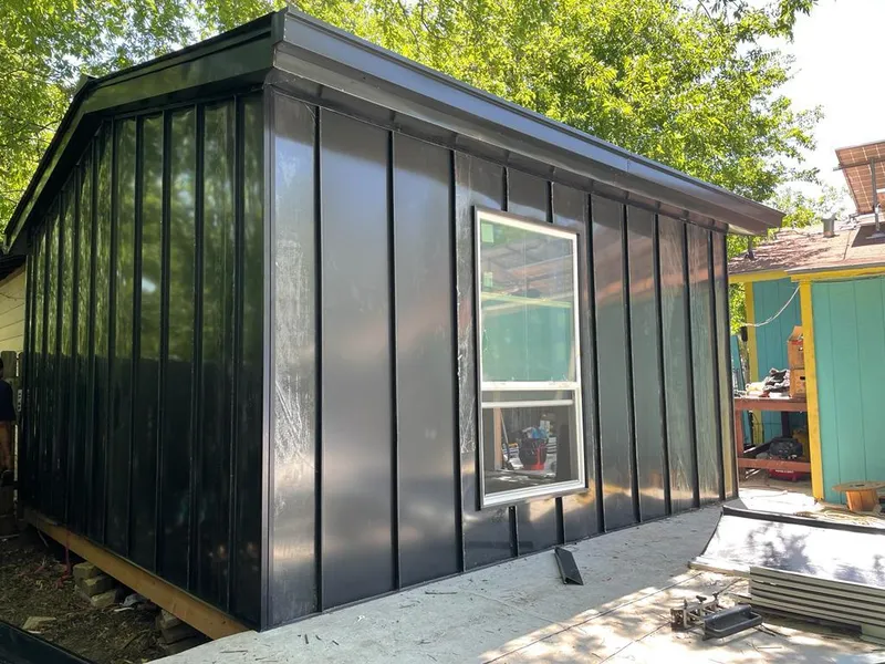 Black standing seam metal wall panels for Roof Inspection in Emerson