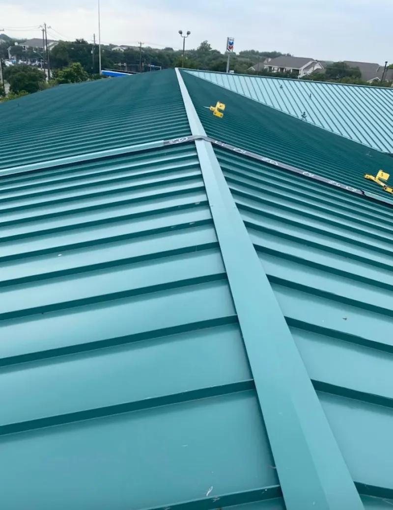 Green commercial metal roof ridge and valley for Metal Roof Repair in Emerson